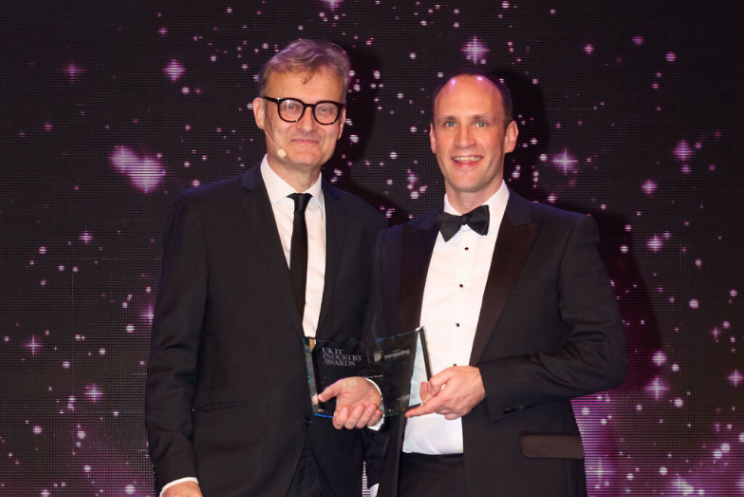 Philip White collecting Best Place to Work award